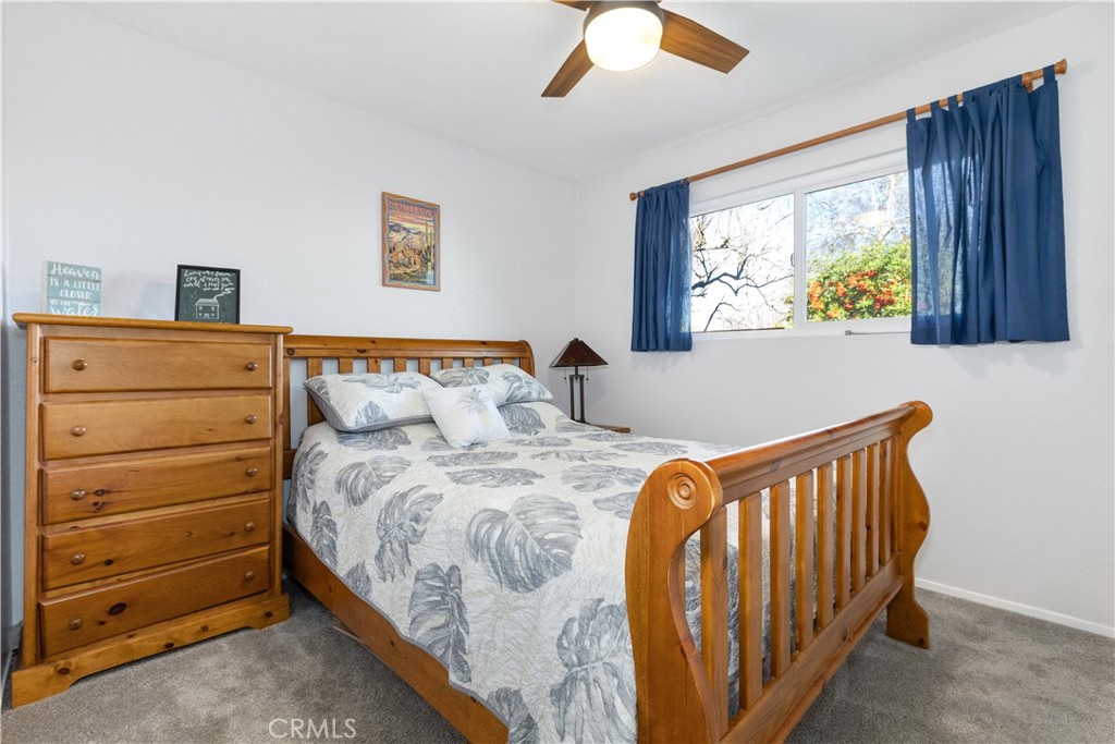 8425 Azucena Avenue Atascadero, CA 93422 - Photo 23 of 47 a bedroom with a bed and a window