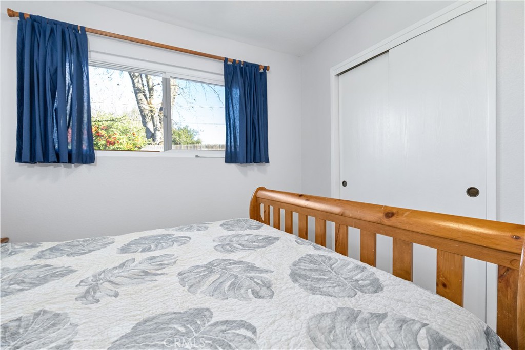 8425 Azucena Avenue Atascadero, CA 93422 - Photo 24 of 47 a bedroom with a bed and a window