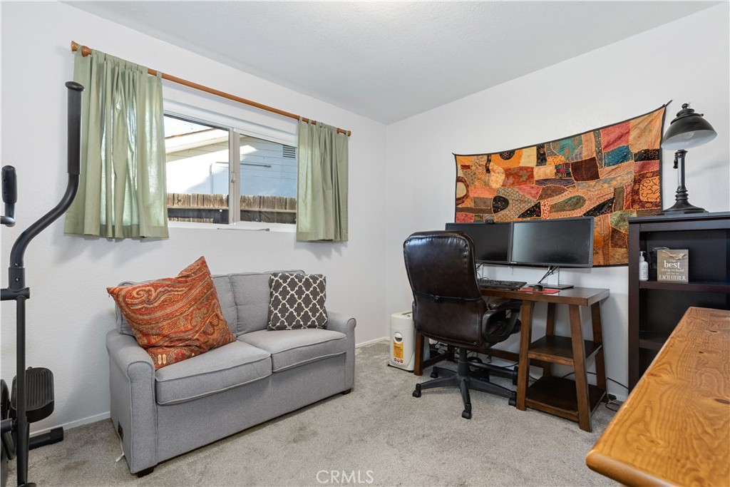 8425 Azucena Avenue Atascadero, CA 93422 - Photo 25 of 47 a living room with furniture and a flat screen tv