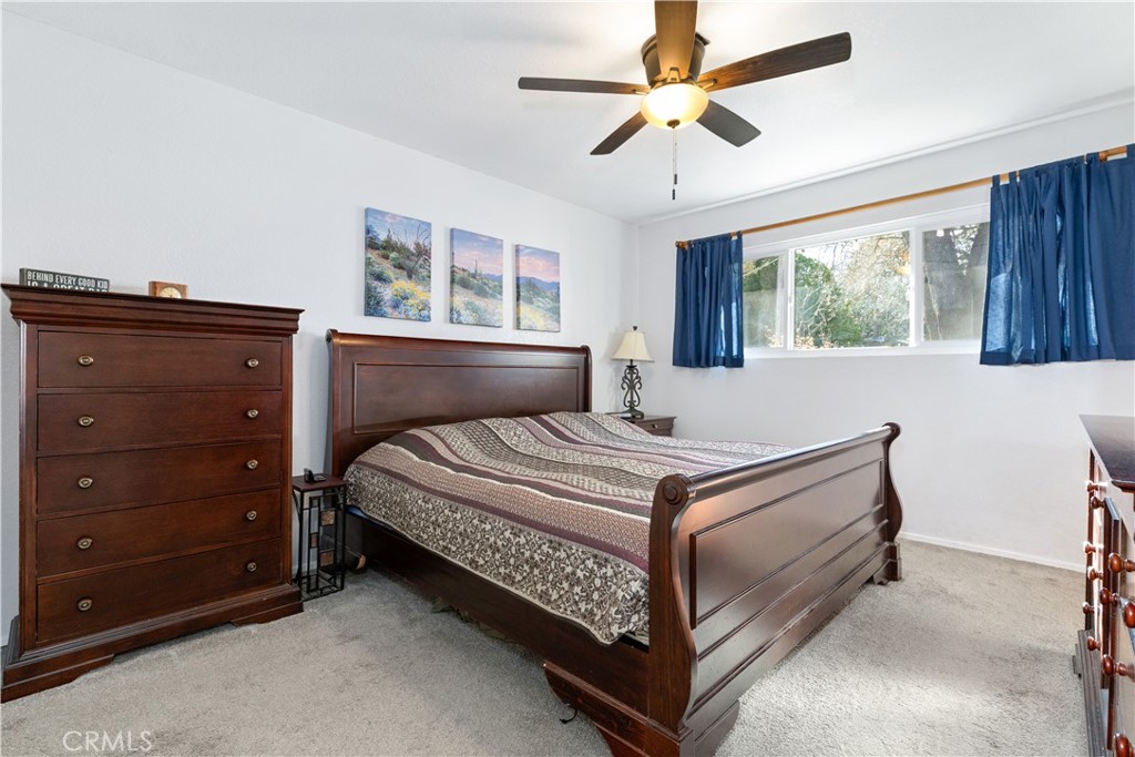 8425 Azucena Avenue Atascadero, CA 93422 - Photo 27 of 47 a bedroom with a bed and window