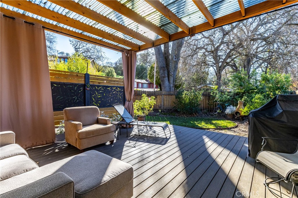 8425 Azucena Avenue Atascadero, CA 93422 - Photo 34 of 47 a balcony with furniture and a garden