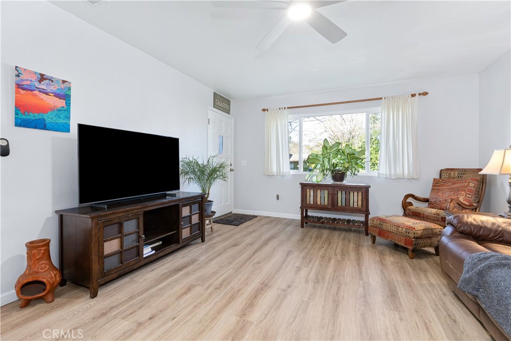 8425 Azucena Avenue Atascadero, CA 93422 - Photo 8 of 47 a living room with furniture and a flat screen tv