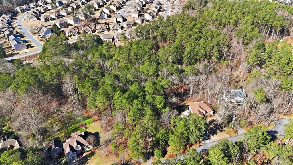 215 Pickett's Way Acworth, GA 30101 - Photo 17 of 23 a backyard of a house with lots of green space and garden