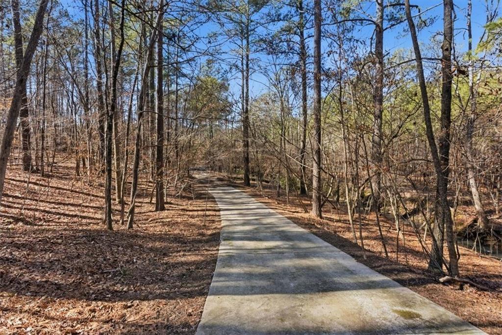 215 Pickett's Way Acworth, GA 30101 - Photo 2 of 23 a view of a pathway of a yard