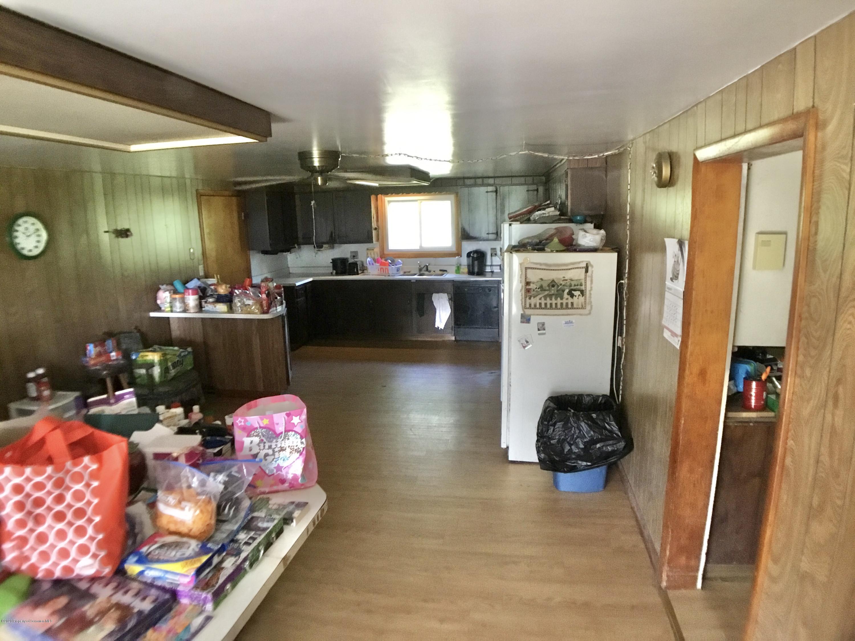 1059 Mountain Valley Road Hallstead, PA 18822 - Photo 21 of 30 a kitchen with a refrigerator and a stove top oven