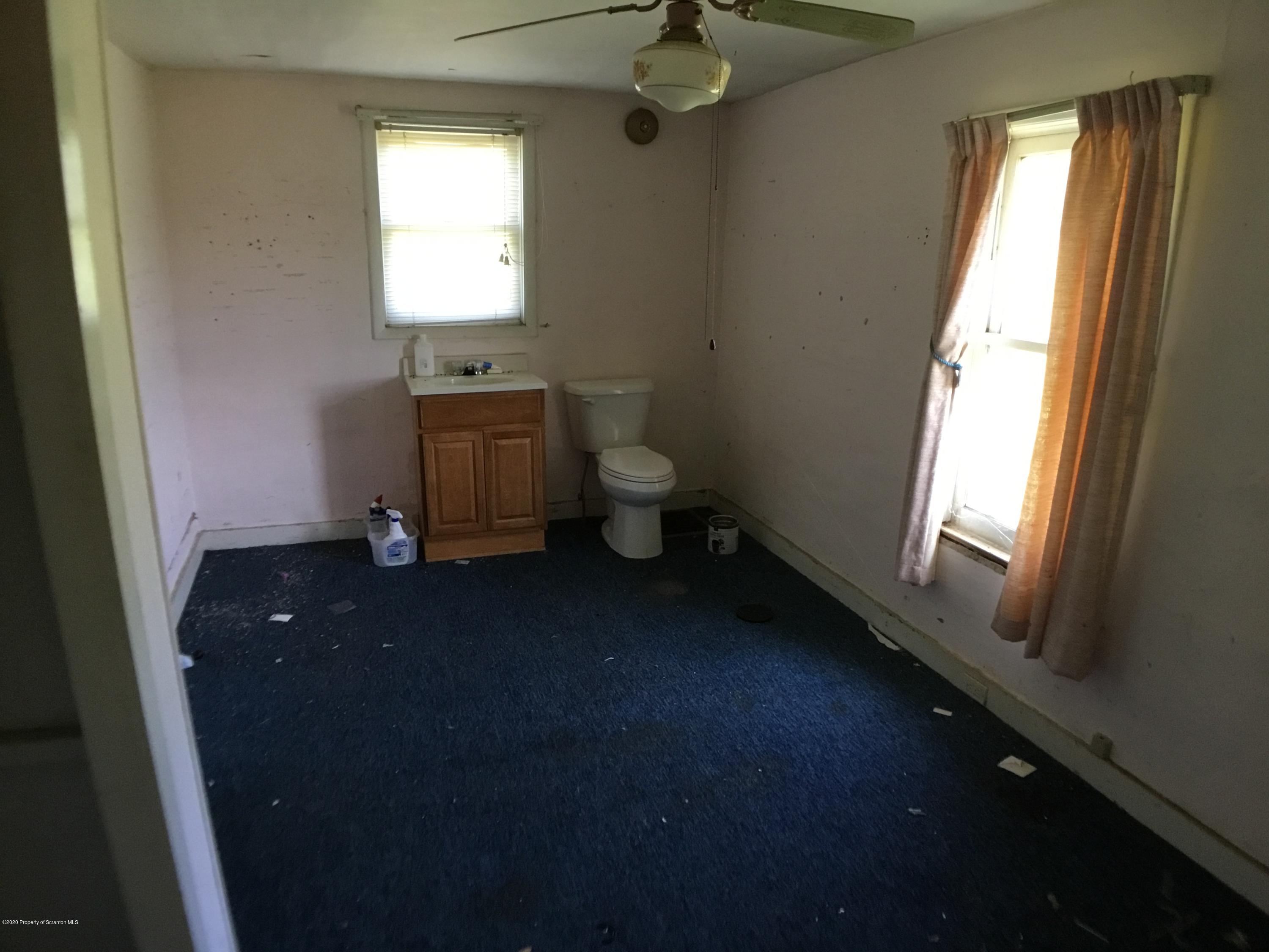 1059 Mountain Valley Road Hallstead, PA 18822 - Photo 29 of 30 a view of a bathroom with a sink and a toilet