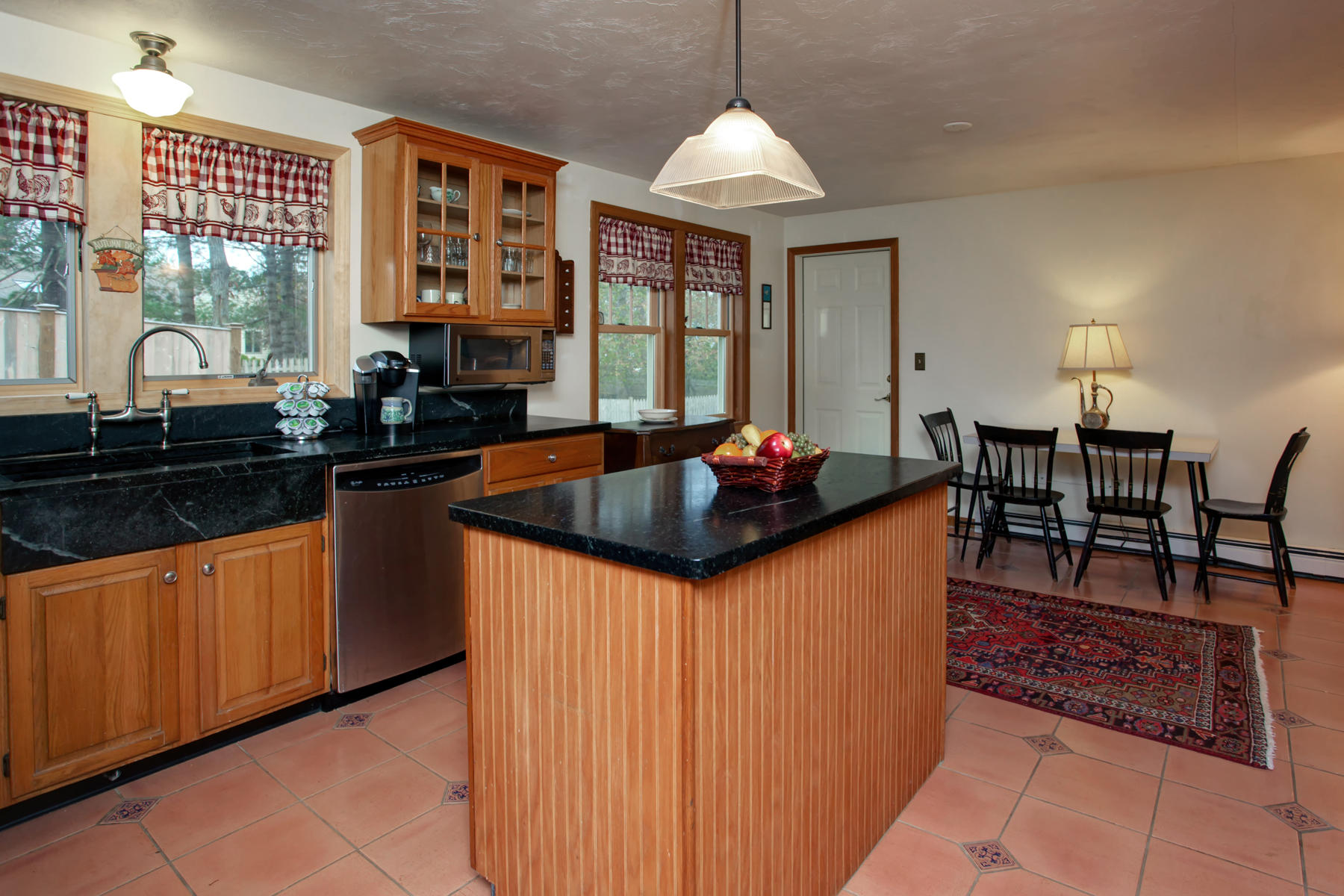 44 Monument Neck Road Bourne, MA 02532 - Photo 8 of 31 a kitchen with stainless steel appliances granite countertop a sink and cabinets