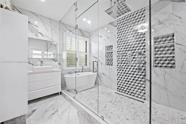 a bathroom with a double vanity sink mirror and shower