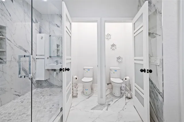 a view of a room with furniture and windows