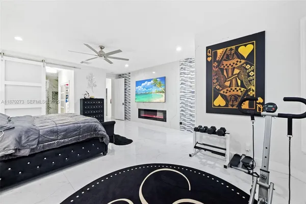 a bedroom with bed and a couch