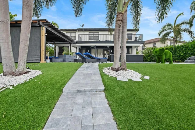 a outdoor living space with furniture and a fireplace