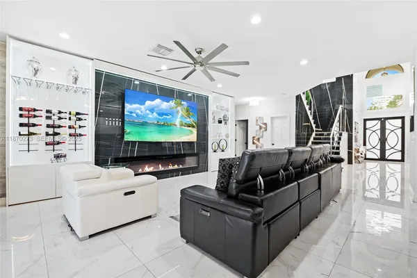 a living room with furniture and a flat screen tv