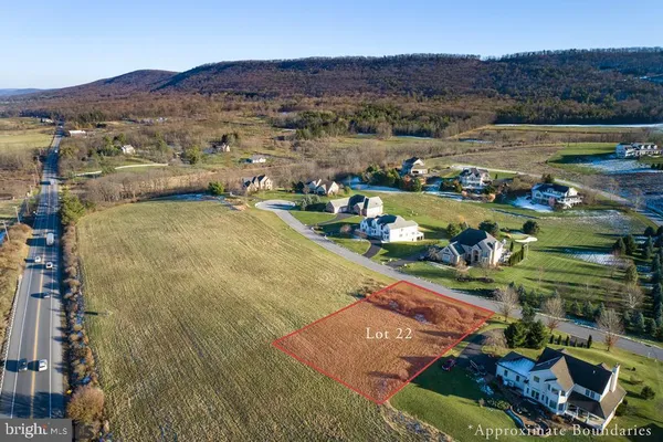 an aerial view of a house with a garden