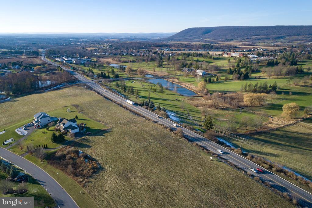 133 Roundhill Road Boalsburg, PA 16827 - Photo 11 of 11 an aerial view of a house with a garden and lake view