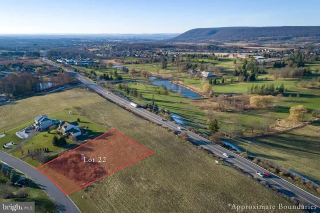 an aerial view of a residential houses and outdoor space