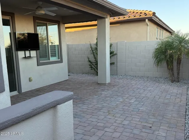 a view of a pathway of a house with a yard