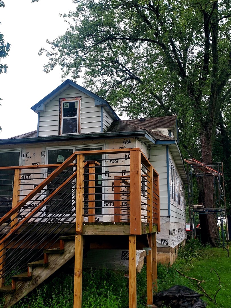 a view of a house with a roof deck