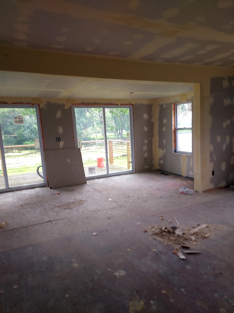 24689 North Fox River Road Cary, IL 60013 - Photo 3 of 6 an empty room with windows