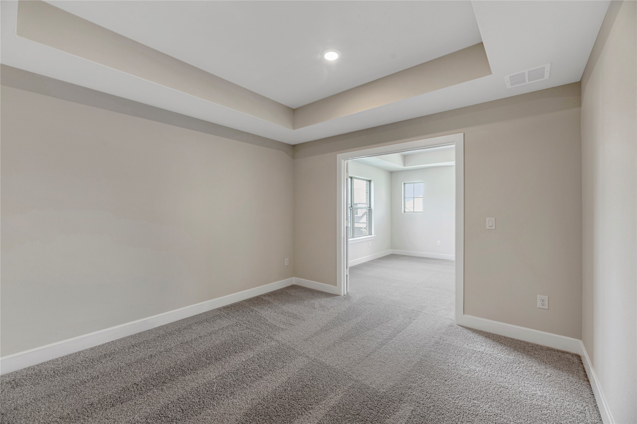 1508 Rodeo Ridge Drive Georgetown, TX 78628 - Photo 20 of 37 Carpeted empty room featuring a raised ceiling and baseboards