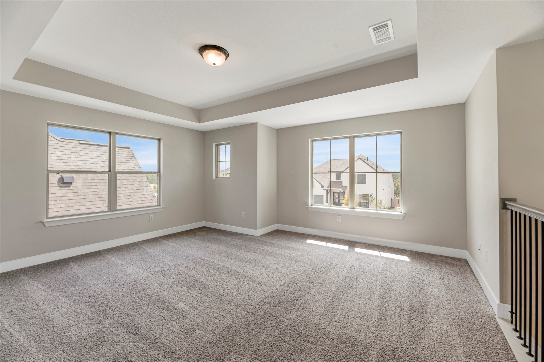1508 Rodeo Ridge Drive Georgetown, TX 78628 - Photo 21 of 37 Spare room featuring light carpet and a tray ceiling