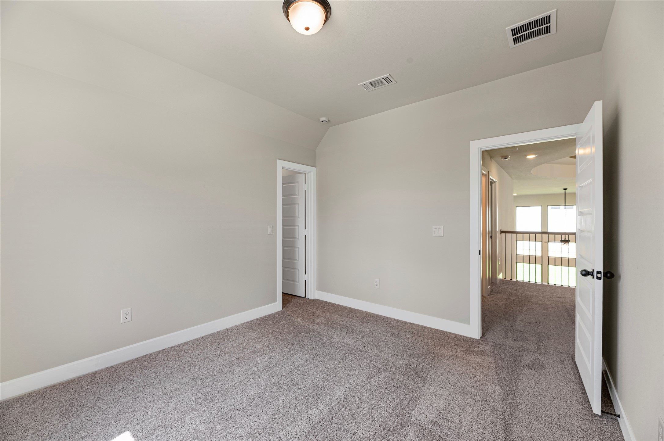 1508 Rodeo Ridge Drive Georgetown, TX 78628 - Photo 22 of 37 Unfurnished room featuring carpet floors and vaulted ceiling