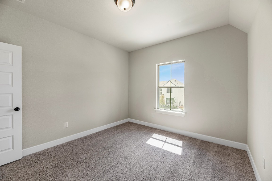 1508 Rodeo Ridge Drive Georgetown, TX 78628 - Photo 23 of 37 Spare room featuring carpet flooring and baseboards