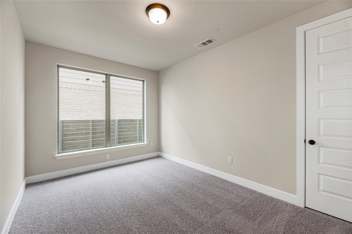1508 Rodeo Ridge Drive Georgetown, TX 78628 - Photo 27 of 37 Carpeted spare room with baseboards