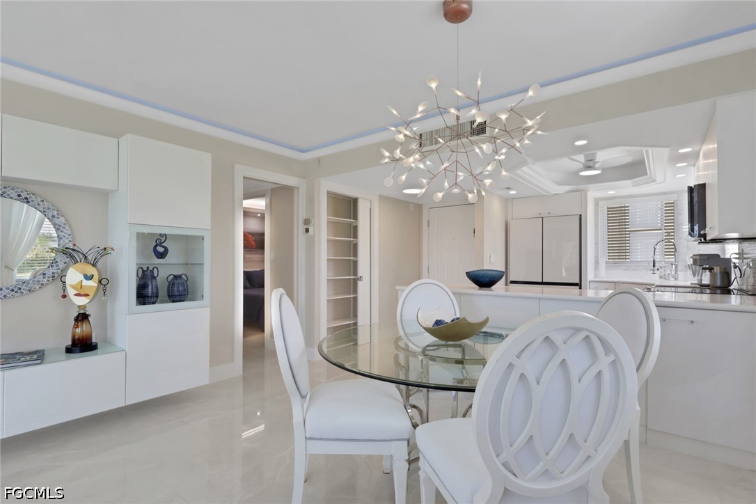 9 High Point Circle North, Unit 101 Naples, FL 34103 - Photo 8 of 49 a very nice looking dining room with furniture