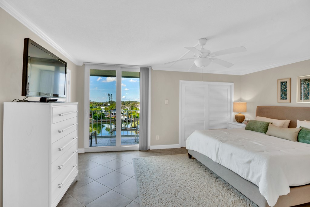 4601 Florida A1A, Unit 405 Vero Beach, FL 32963 - Photo 21 of 36 a bedroom with a bed and a dresser