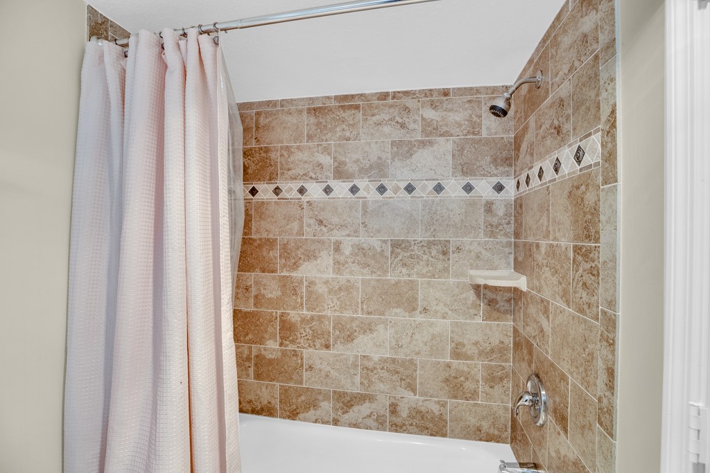 4601 Florida A1A, Unit 405 Vero Beach, FL 32963 - Photo 27 of 36 a bathroom with a shower