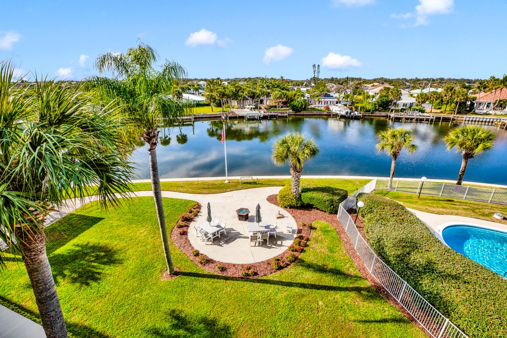 4601 Florida A1A, Unit 405 Vero Beach, FL 32963 - Photo 3 of 36 a view of a swimming pool with a lake