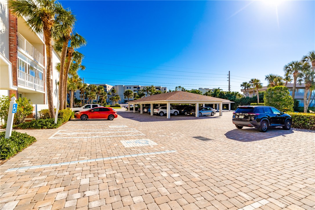 4601 Florida A1A, Unit 405 Vero Beach, FL 32963 - Photo 31 of 36 a cars parked on the side of a street