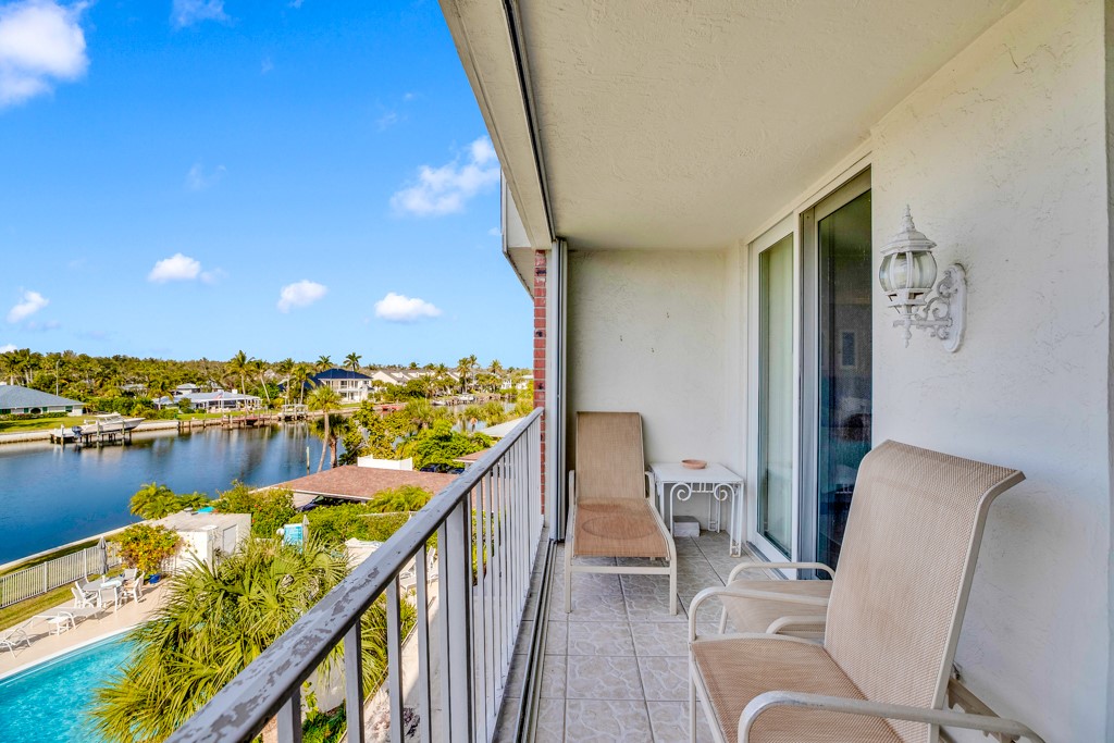 4601 Florida A1A, Unit 405 Vero Beach, FL 32963 - Photo 6 of 36 a view of a balcony with chairs