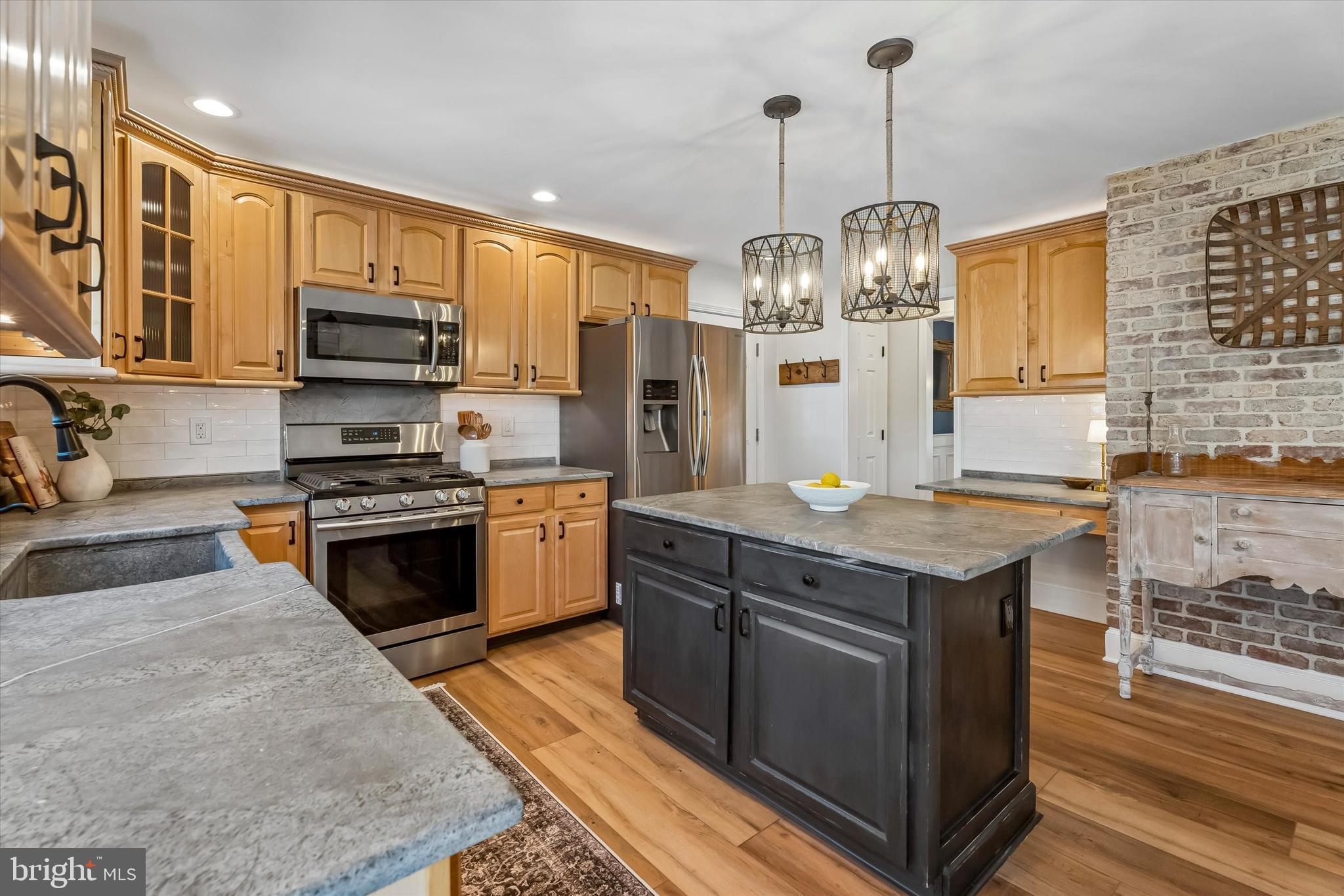 649 Glendale Road Havertown, PA 19083 - Photo 16 of 67 a kitchen with stainless steel appliances granite countertop a stove and a sink