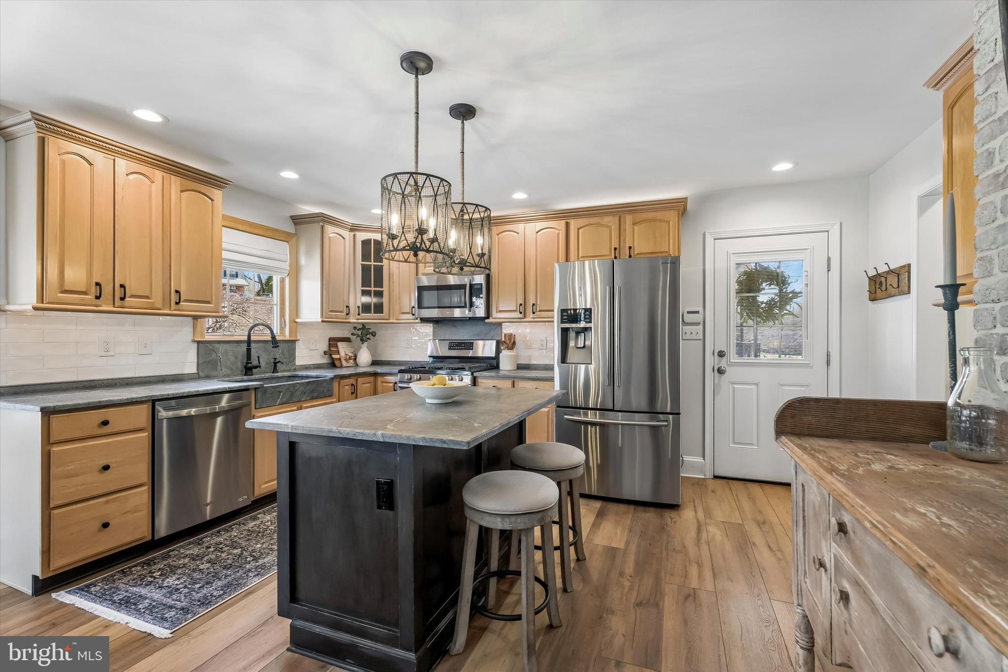 649 Glendale Road Havertown, PA 19083 - Photo 17 of 67 a kitchen with center island and stainless steel appliances