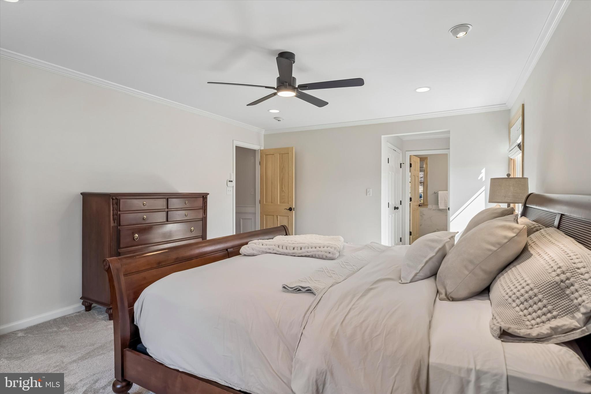 649 Glendale Road Havertown, PA 19083 - Photo 23 of 67 a bedroom with a bed and a chandelier