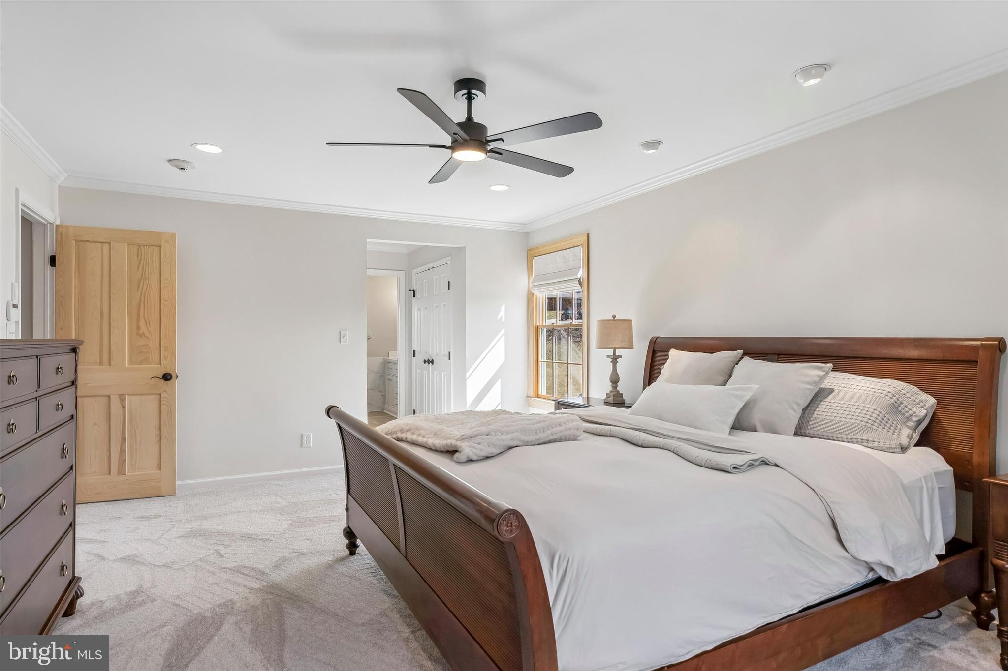 649 Glendale Road Havertown, PA 19083 - Photo 24 of 67 a bedroom with a bed and a chandelier