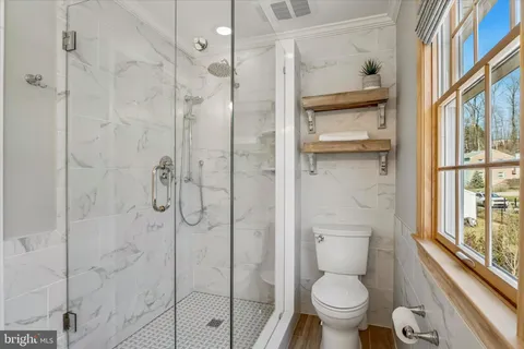 a bathroom with a double vanity sink and mirror