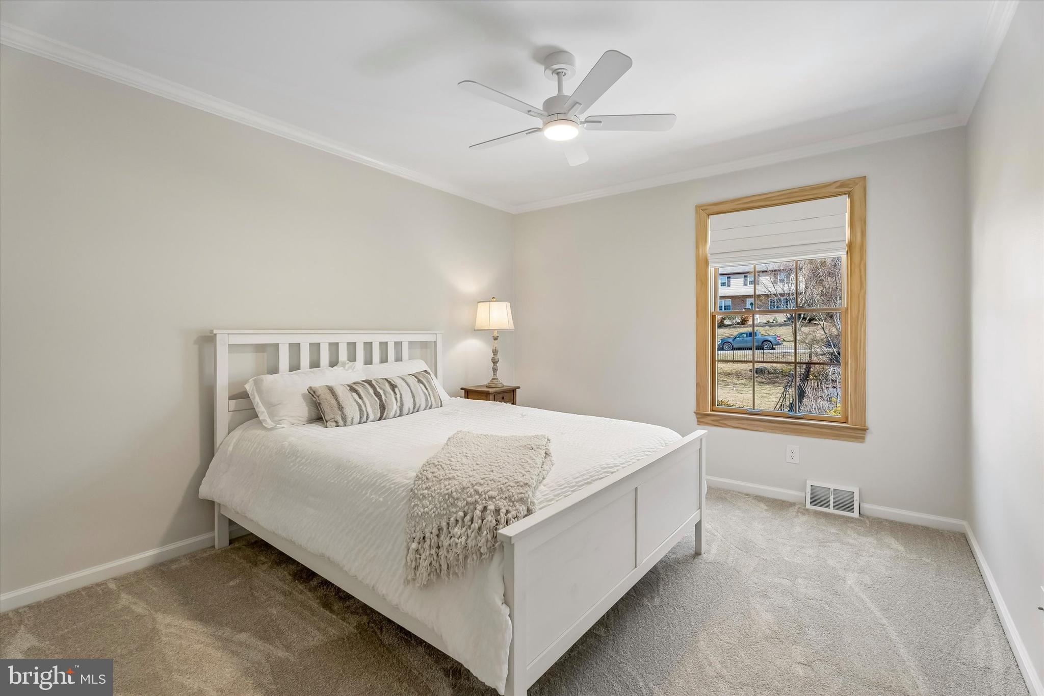 649 Glendale Road Havertown, PA 19083 - Photo 29 of 67 a bedroom with a bed chandelier and a window