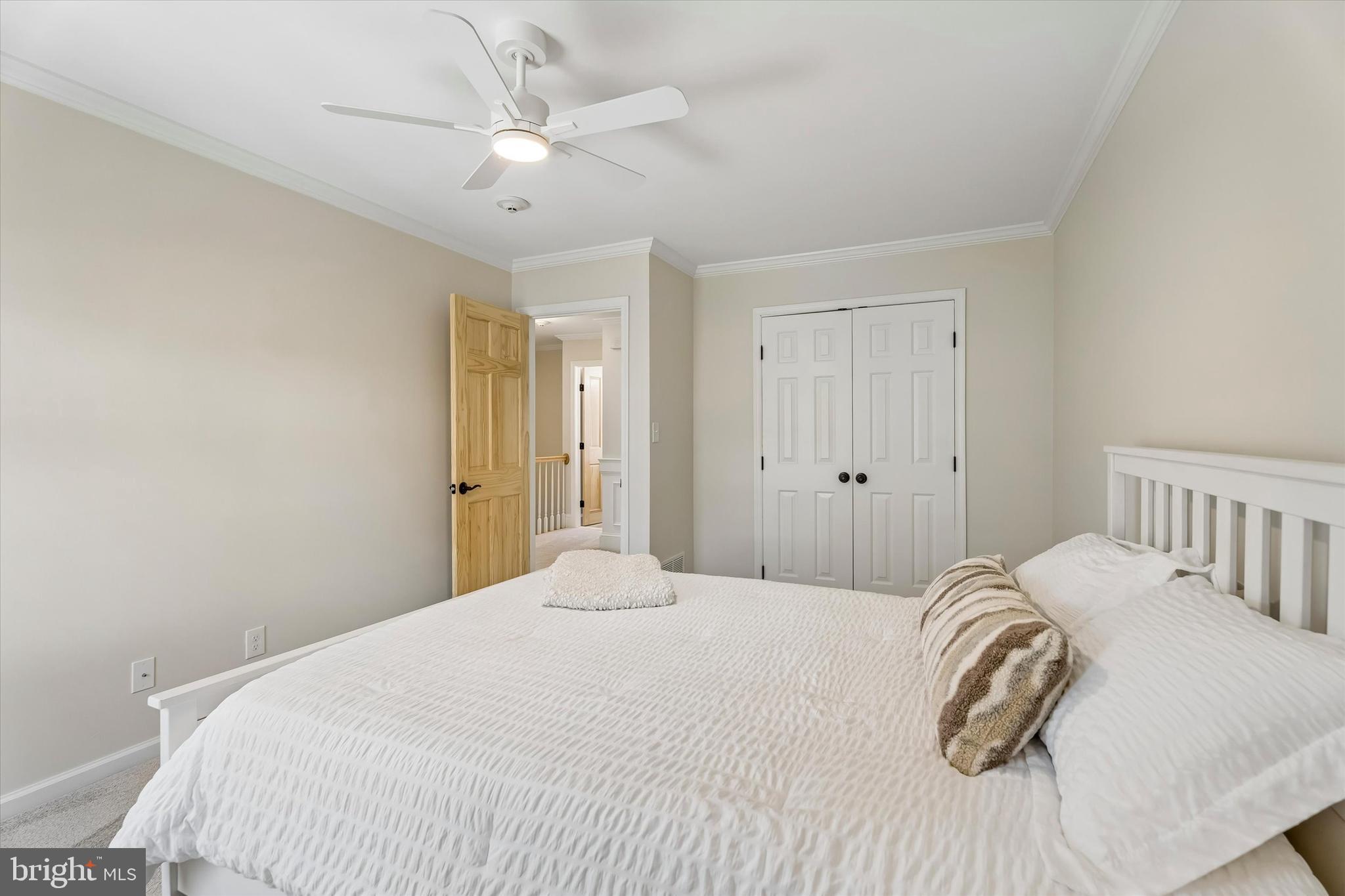 649 Glendale Road Havertown, PA 19083 - Photo 30 of 67 a bedroom with a white bed and a chandelier