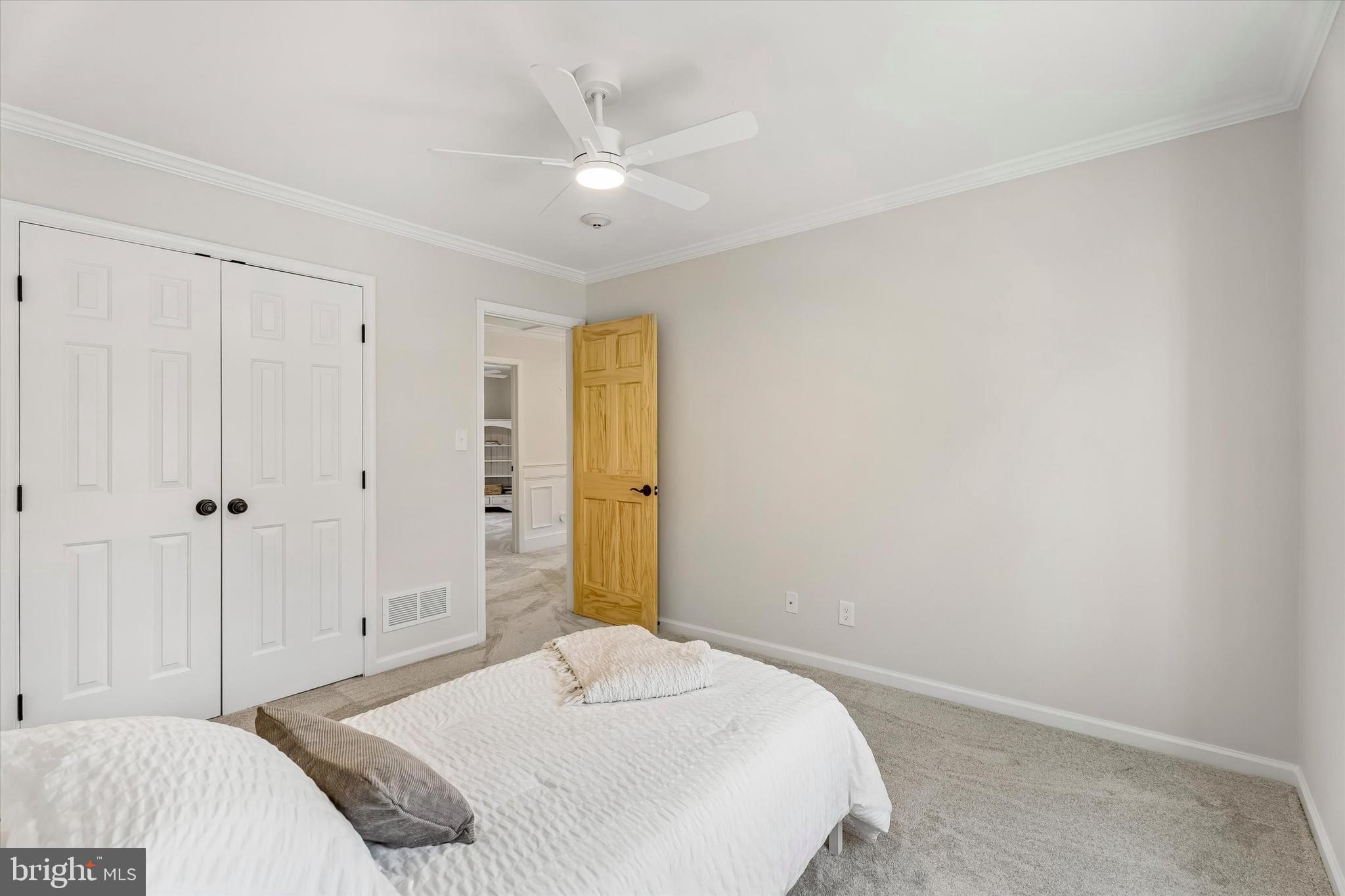 649 Glendale Road Havertown, PA 19083 - Photo 32 of 67 a bedroom with a bed and a chandelier