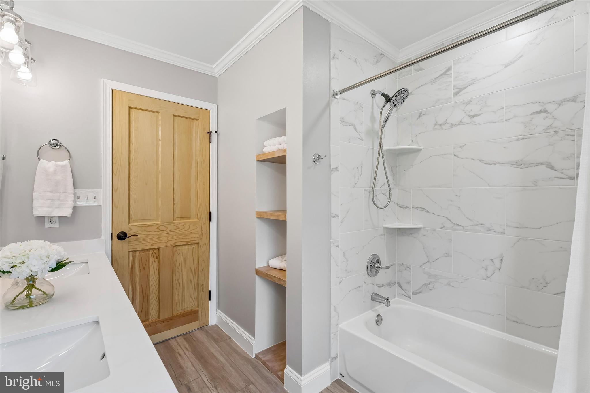 649 Glendale Road Havertown, PA 19083 - Photo 35 of 67 a bath room with a bath tub and a shower
