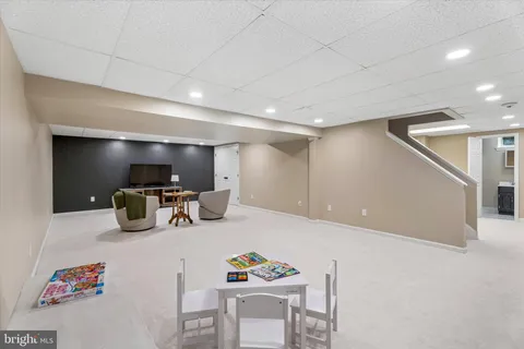 a view of a house with backyard porch and sitting area