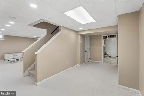 a view of a yard with a house and trees