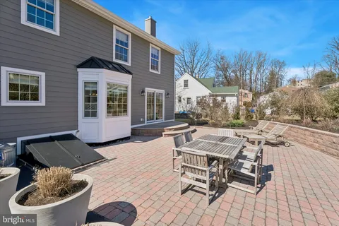 an aerial view of residential house with outdoor space and parking