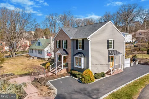 a view of dirt yard with a large tree