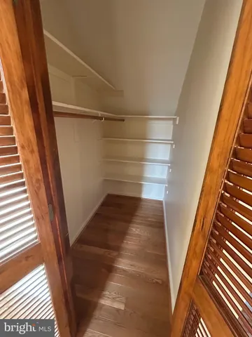 a view of an empty walk in closet