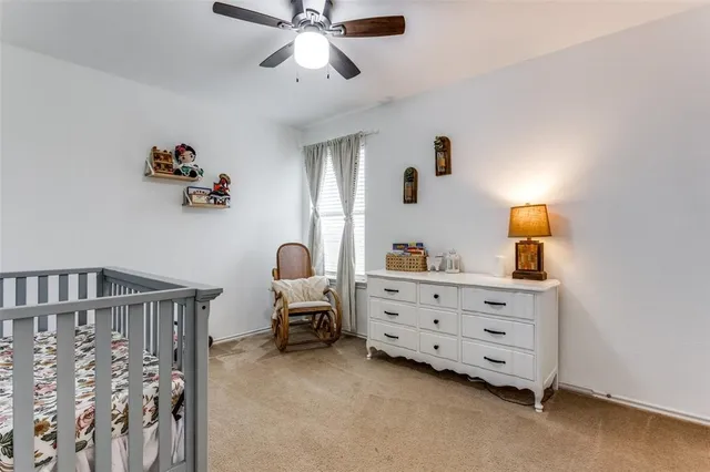 a bed room with furniture and a window