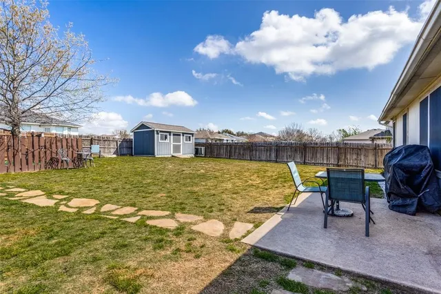 a view of a swimming pool and a lounge chair