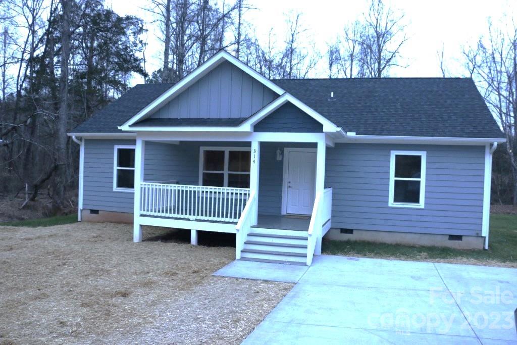 314 John Smith Road Rutherfordton, NC 28139 - Photo 1 of 25 a view of a house with a yard and wooden fence